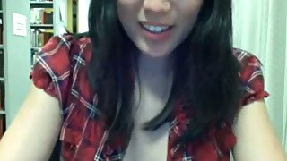 Quite naughty slender Asian girl flashes her tits on cam in the library