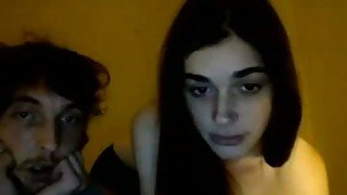 Skinny and cute brunette teen is fed with a dick on webcam