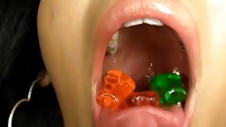 Two hot girls swallow gummy bears and worms