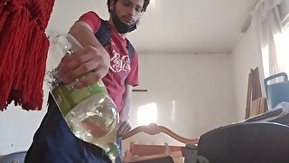 Backpack man Pissing in a bottle before leaving home and pluging, anal plug in