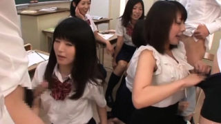 Japanese schoolgirl teases a large knob making the lad cum