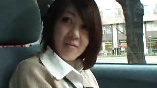 Japanese girl playing naughty in the car