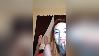 Sexy Redhead Teen Shows Her Attractive Feet As Posing On Her Webcam