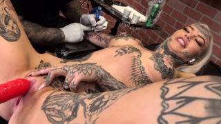 Amber Luke masturbates while getting tattooed