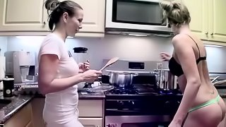 Two girls cooking naked in the kitchen