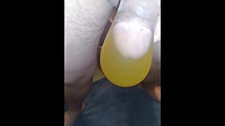 Filling a condom with pee