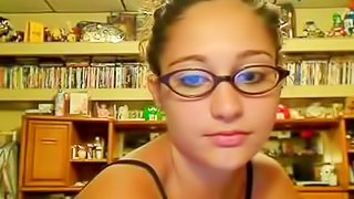 Babe in cute glasses is fucking on the webcam