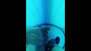 Jerking off in the tanning booth. Hard cock