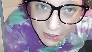 Liza works a cumshot out of Andy's cock and all over her glasses