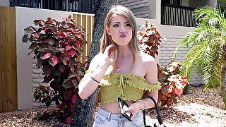 Alexa Kiss is getting picked up outdoors