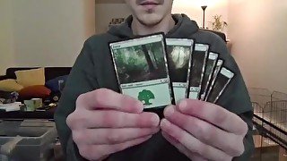 Cute Nerd Open a Pack of Trading Cards