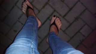 Glossy black toe nail polish and platform flip flops