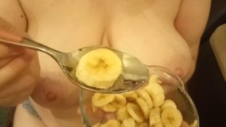 Redhead milf milks sperm onto her banana dessert.