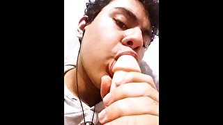 cute boy practicing blowjob on dildo