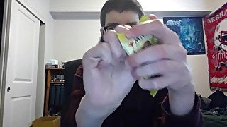 Cute Nerd Opening a Pack of Magic The Gathering Cards