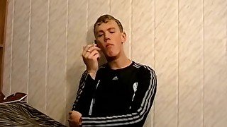 Big dick blond soccer twink Roma smokes cigs while wanking