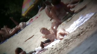 Beach voyeur vid of hippy blonde chick nude sunbathing