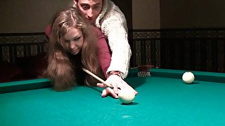 Toples girl with  small tits is playing billiard