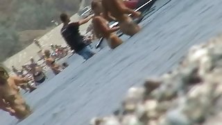 lots of very sexy naked babes on the nudist beach getting wet