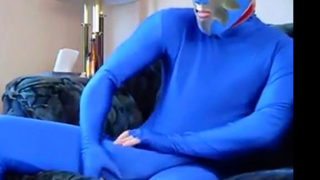 dude in mask a blue zentia suit strokes his big cock