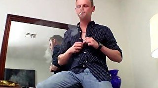 Dallas Cage spanks his monkey while smoking a cigarette