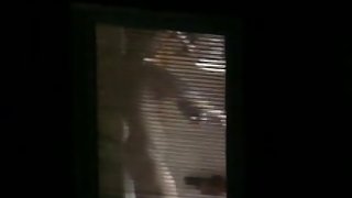 Nude candid female with a big sexy ass filmed through a window