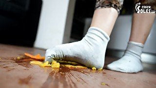 Wild Brunette In Socks Crashes An Orange With Her Feet