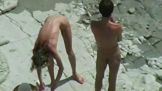 Babe bends over to take cock at beach