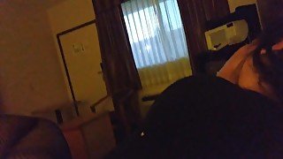 Having fun in motel with window open