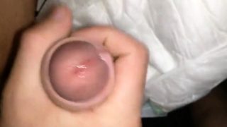 Twink cumming his wet diaper