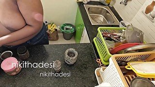 Nude girl dish wash in kitchen