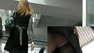 Fishnets up redhead's mini