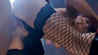 Brunette babe wearing fishnet stockings gets facialized during hardcore sex