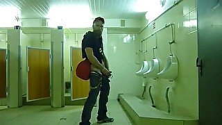 Guy stroke in public toilet