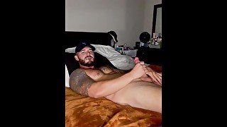 Tattooed alpha male strokes his cock until he cums