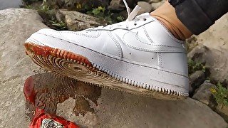 Boy crushes a ketchup packet with his new white sneakers Nike Air Force One AF1 sockless foot fetish