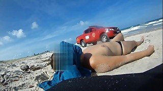 Topless at public beach caught by firefighters