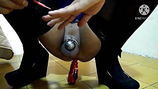 Sissy in chastity doing her nails with a vibrator in the ass. Sissy's proper way to do her nails.