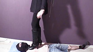 Two beauties trample a slave with their boots Trampling