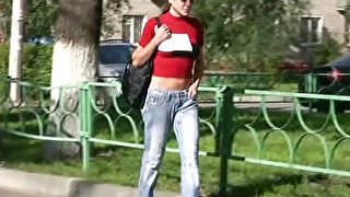 Lovely amateur brunette girl in jeans pisses in public