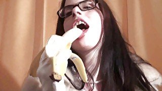 Spex brunette talking dirty while eating banana