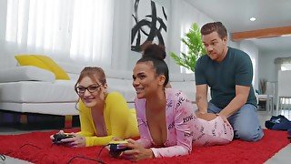 Interracial threesome makes the girls forget about video game