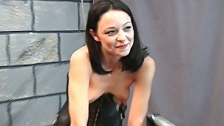 Skinny brunette with clamps on her tits is punished