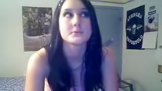 Nasty brunette speaks to a guy on Skype and shows her tits