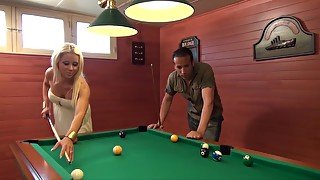 This blonde enjoys playing pool today