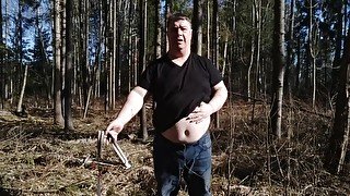 Undressing in a sunny spring forest for my fans