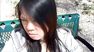 ASIAN GIRL SUCKING DICK IN A PUBLIC PARK