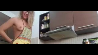 Cute teen painting eggs and dancing naked in the kitchen