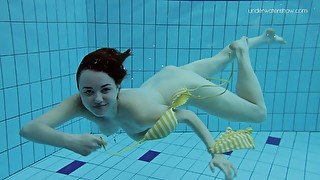 Busty brunette teen babe from Russia strips underwater