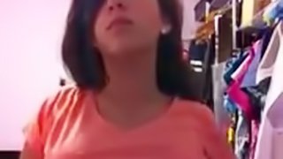 Dark haired teen plays with big tits